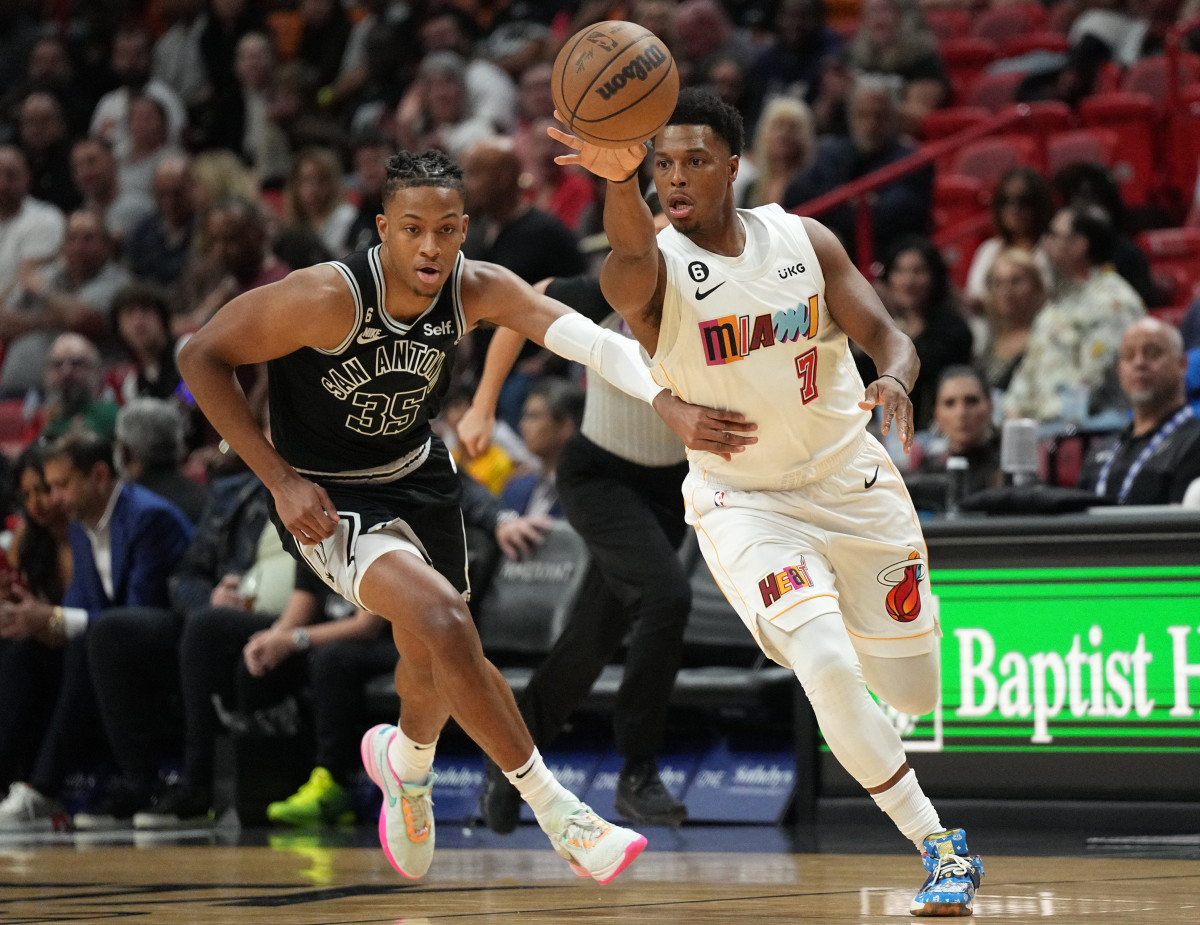 San Antonio Spurs guard Romeo Langford and Miami Heat guard Kyle Lowry.